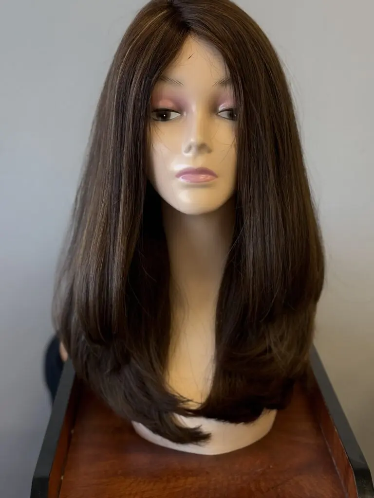 Long brown layered human hair wig.